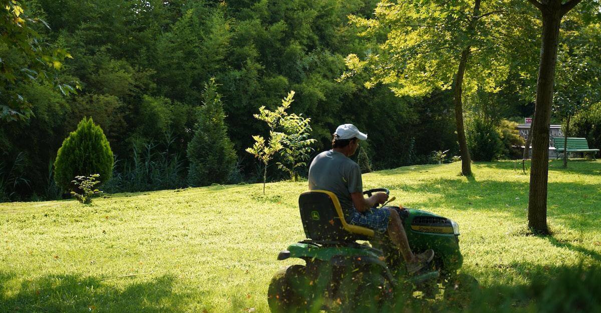 man-mowing-the-green-lawn