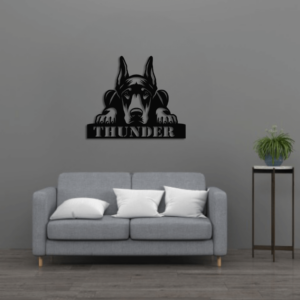 doberman crouching sign on wall